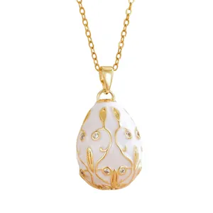 Elegant Russian egg pendant necklace with white enamel and sparkling crystals on gold chain