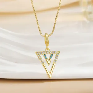 Golden titanium steel necklace with double triangle pendant, white diamonds and blue beads