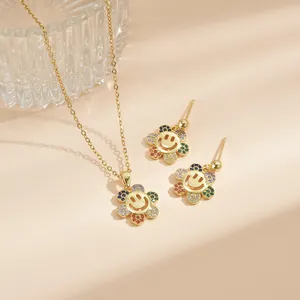 Schmuckset aus Gold mit lächelnder Sonnenblume und bunten Zirkonia-Steinen