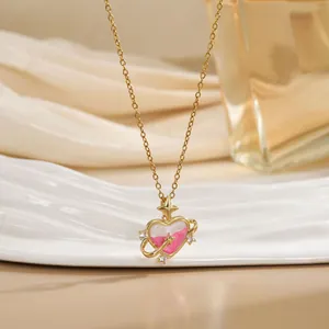 Pink heart star pendant necklace with gold chain and cubic zirconia accents