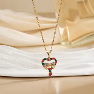 Collier de Noël doré avec pendentif sucre d'orge cœur et nœud en zircons colorés