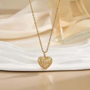 Elegant gold heart cage pendant necklace with inner white pearl and cubic zirconia accents