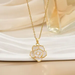 Elegant gold necklace featuring white camellia flower pendant on minimalist link chain