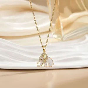 Elegant gold elephant pendant necklace with white inlay and zircons on a slender O-chain