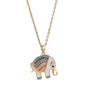 Golden elephant pendant necklace with white enamel and colorful crystals on white background