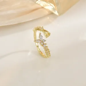 Elegant gold butterfly zircon ring with marquise and teardrop stones in a luxury design