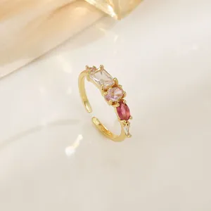 Elegant adjustable gold ring with pink gradient zircon stones in a sweet minimalist style