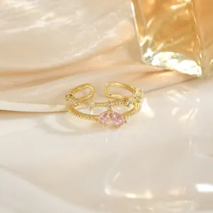 Bague double couche dorée réglable avec zircon rose et pavage de pierres brillantes