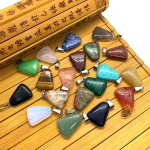 Triangle natural stone pendants collection on bamboo mat for jewelry making