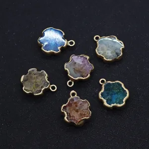Detail of six-petal flower pendants with assorted natural stone chips and gold plating