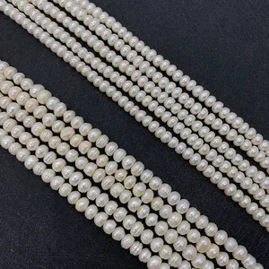 Macro detail showing rows of white natural freshwater button pearls with soft luster