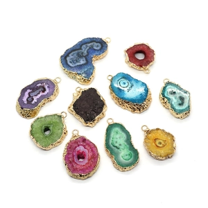 Irregular natural stone crystal pendants with gold-plated edges in multiple vibrant colors