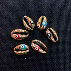 Golden plated sea shell charms with evil eye beads for DIY necklace jewelry making
