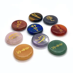 Set of 9 Reiki healing energy stones with gold symbols on round flat natural gemstones