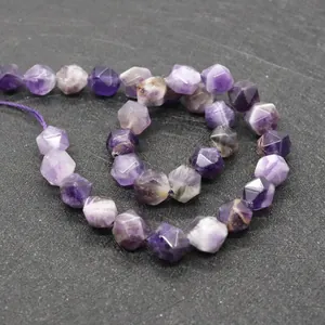 Macro detail of faceted natural amethyst beads with unique crystal textures for DIY jewelry