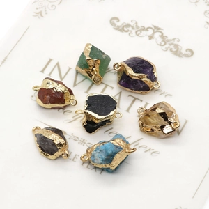 Irregular natural stone pendants with gold plated edges and double connector rings