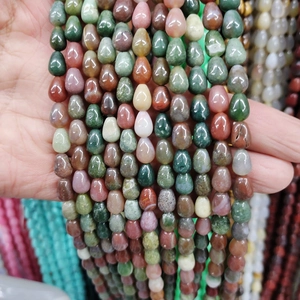 Macro detail of mixed color teardrop gemstone beads for DIY jewelry making and crafts