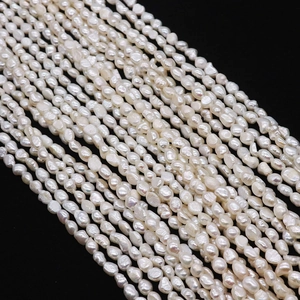 Macro shot of natural baroque freshwater pearls with high luster on black background