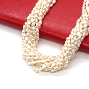 Natural freshwater baroque pearl necklace with multi-strand layered design on red leather