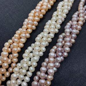 Braided multi-strand natural freshwater pearl necklaces in white, pink, and purple colors
