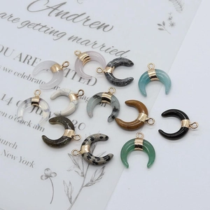Natural stone crescent moon pendants in multiple colors with golden metal ring clasps