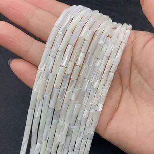 Detailed macro view of natural white mother of pearl cylinder beads for DIY jewelry making