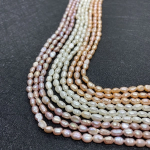 Strands of 5-6mm natural freshwater rice pearls in white, pink, and purple colors