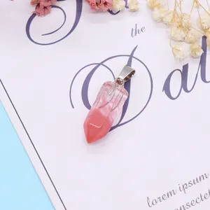 Macro detail of a hexagonal natural stone pendant with pink and white gradient patterns