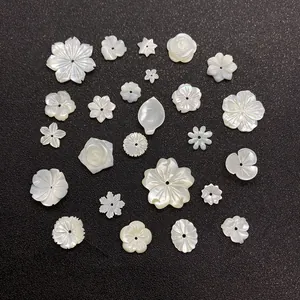 Detailed macro view of white iridescent shell flower beads for DIY jewelry making