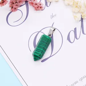 Macro detail of malachite hexagonal bullet pendant with polished silver metal bail