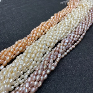 Macro view of 5-6mm irregular freshwater pearls in white, pink and purple shades