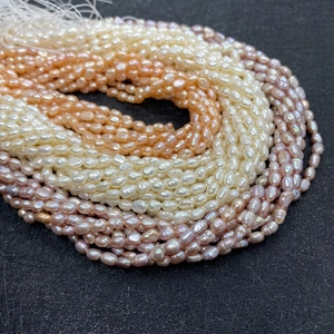 Close-up of 5-6mm natural baroque freshwater pearls in white, pink, and purple shades