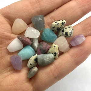 Natural faceted gemstone beads mix including amethyst and amazonite held in hand