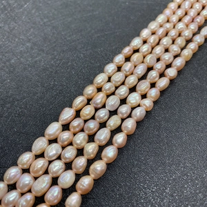 Macro detail of oval pink freshwater pearls with strong luster for DIY jewelry making