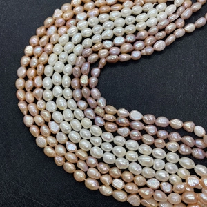 Macro shot of natural freshwater baroque pearls in white pink and purple for DIY jewelry