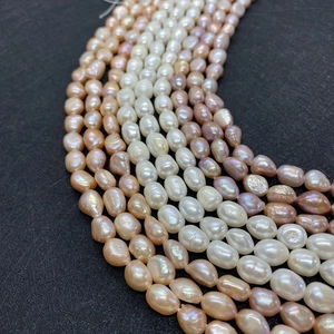Natural freshwater baroque pearl strands in white, pink, and purple with a high luster finish