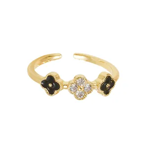 Lucky four-leaf clover open ring in gold with black enamel and sparkling crystals