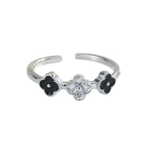 Lucky clover open ring with white cubic zirconia and black enamel inlay design
