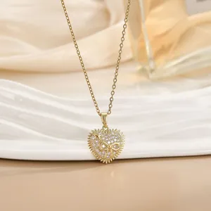 Collana con pendente a cuore in oro 18 carati con fiocco in zircone e design a stella