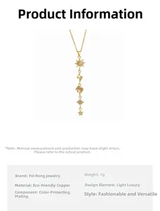 Detail of gold fringe necklace featuring sun, palm tree, and star charms with zircon inlay