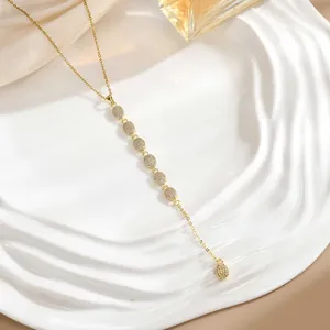 Elegant gold long Y-necklace with circular pendants micro-paved in sparkling zircons