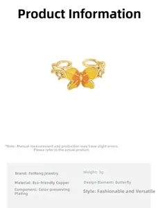 Detailed view of enamel butterfly ring in gold-plated copper with gradient orange wings