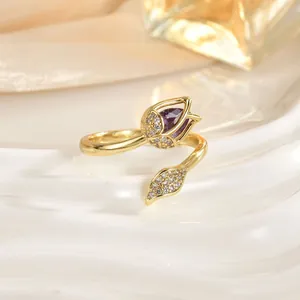 Close-up of tulip ring with purple cat-eye stone and cubic zirconia inlay