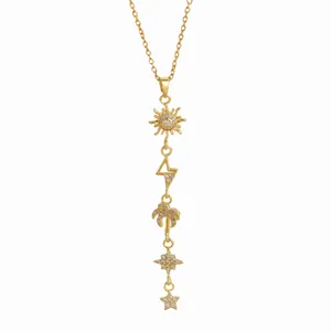 Golden sun star moon tassels long necklace with cubic zirconia pendants on white background