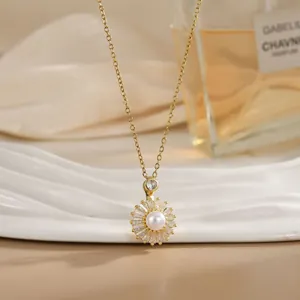 Detailed macro of golden necklace featuring a pearl daisy pendant with sparkling crystals