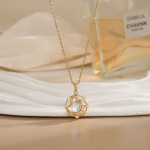 Close-up of a rotating flower pendant necklace with opal center and zircon accents