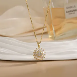 Detail shot of a rotating gold sunflower pendant necklace with sparkling cubic zirconia