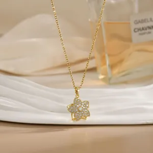 Close-up of rotatable flower necklace with gold plating and sparkling zircon stones