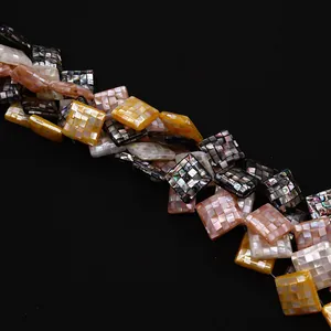 Macro shot of colorful 20mm mosaic shell beads with natural mother of pearl luster