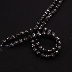 Macro view showing high-gloss black shell beads with mosaic grid texture for DIY jewelry